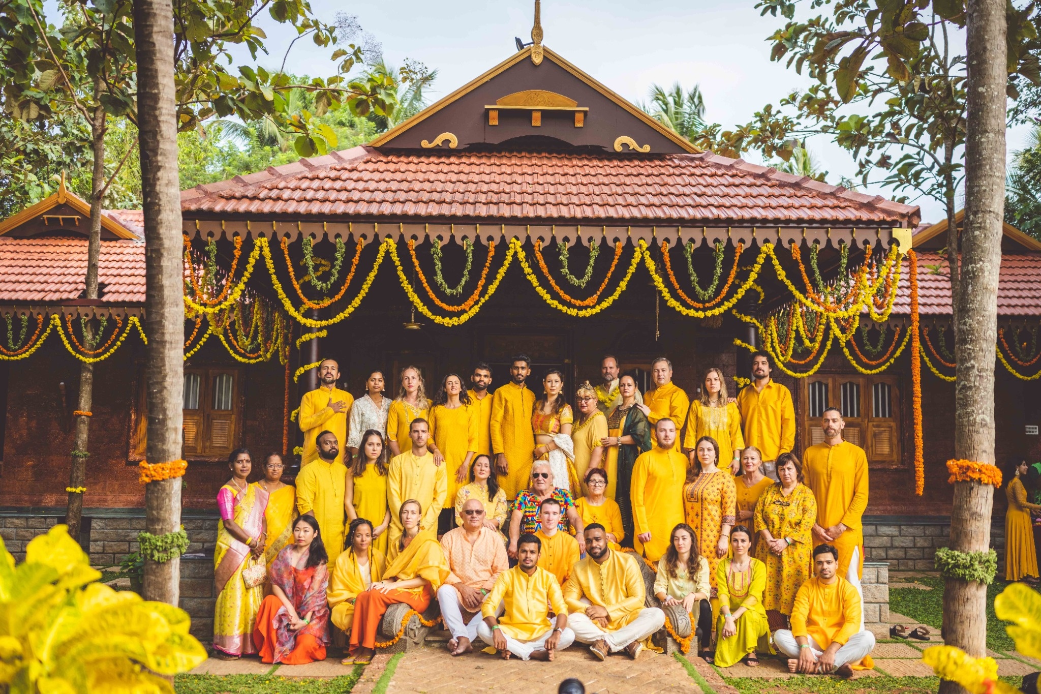 Stella Bella spiritual pilgrimage group practicing yoga at ancient South Indian temple during transformative journey